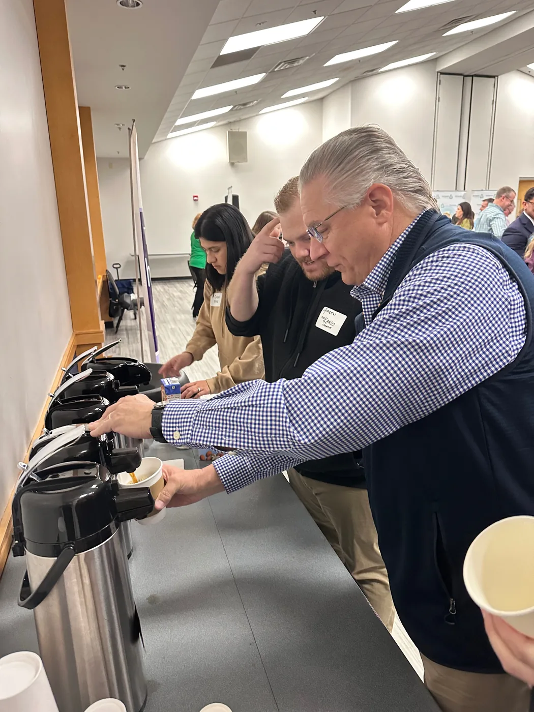 Attendees pouring Emerson's Coffee at Catawba County Chamber Morning Brew, Highland Recreation Center, Hickory NC