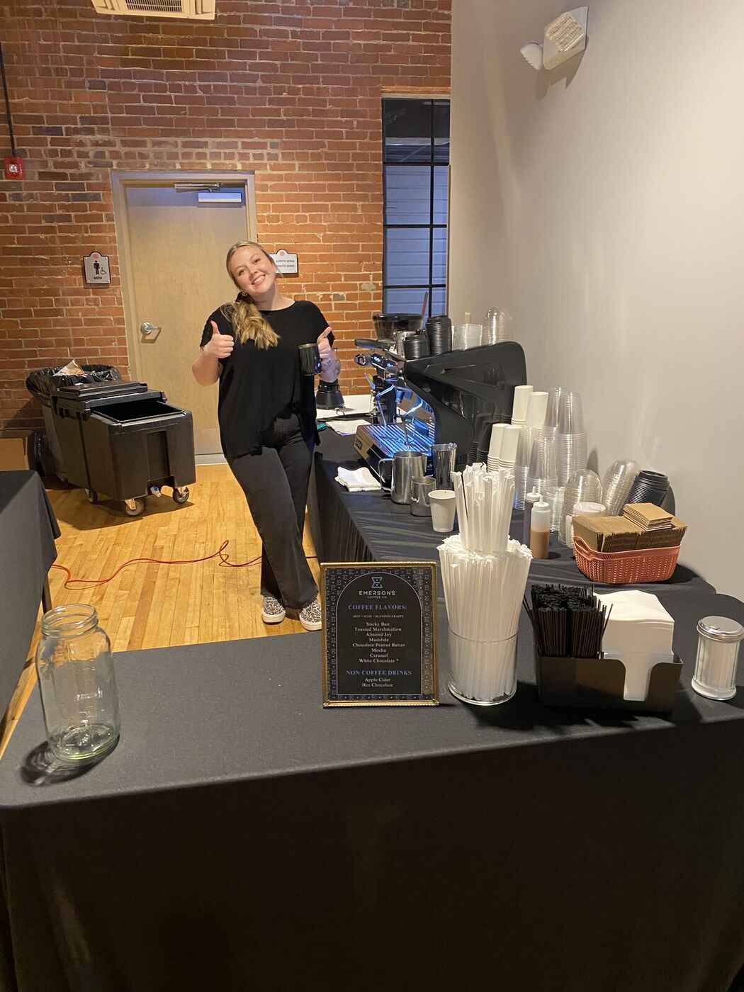 Emerson's Coffee barista serving the wedding coffee bar at Moretz Mill in Hickory, NC